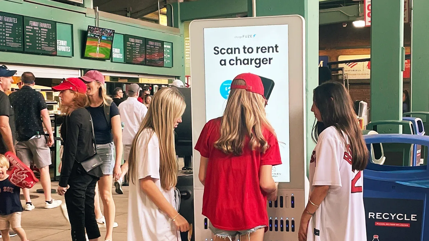 A Chargefuze station in use on a stadium concourse